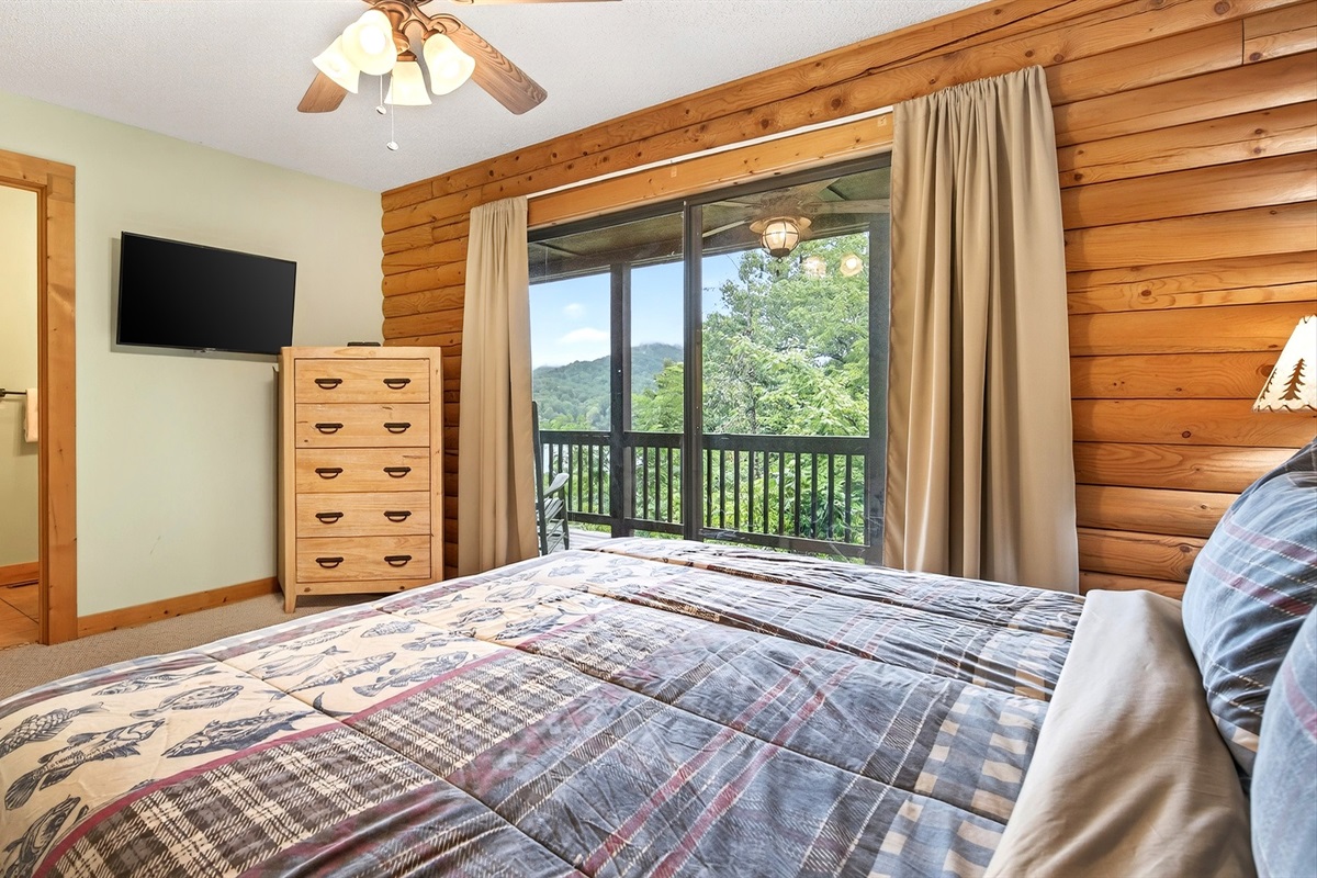 The king bedroom has a TV and dresser