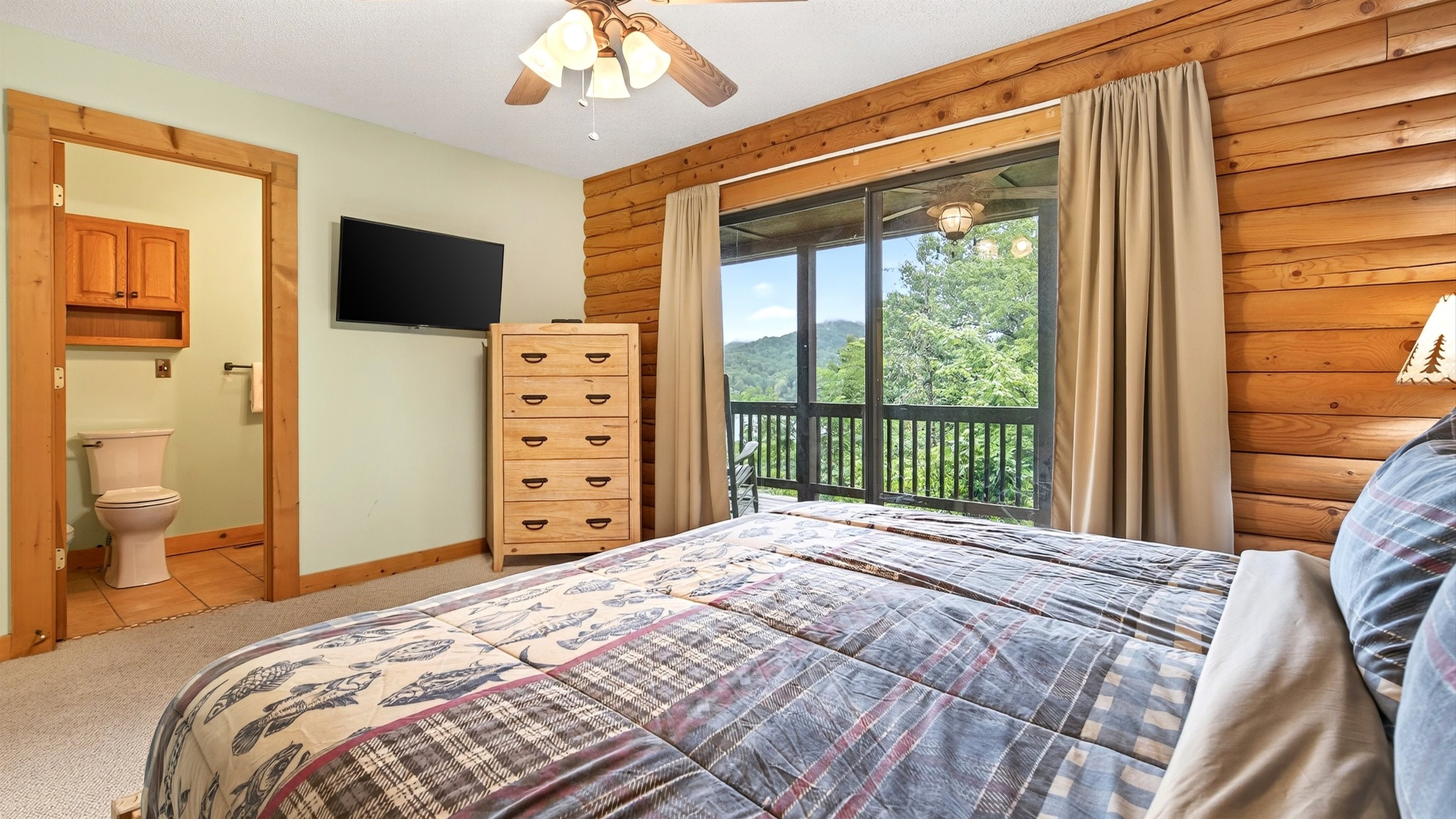 The king bedroom has a TV and dresser