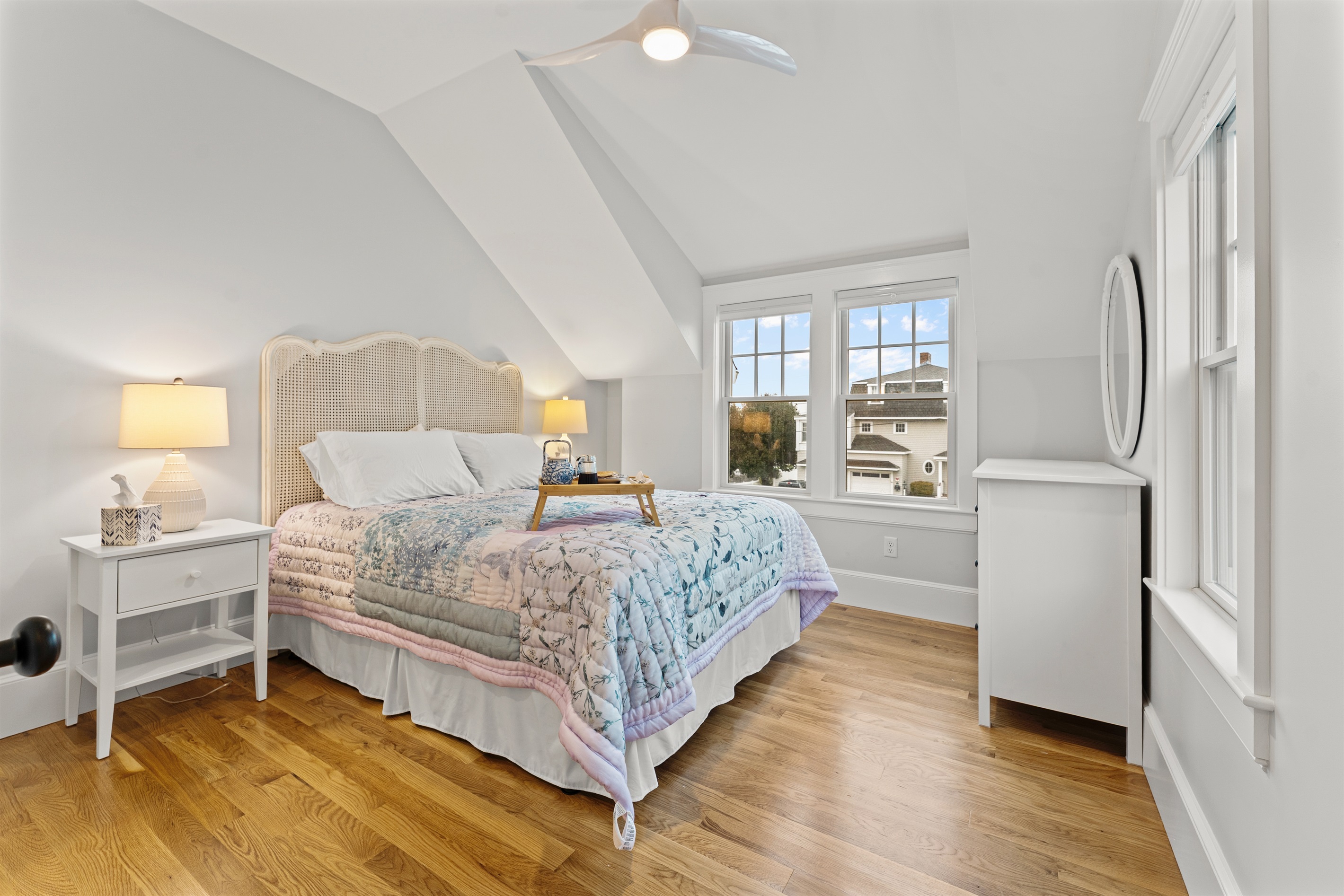 Enjoy natural light and cozy comforts in the first bedroom.