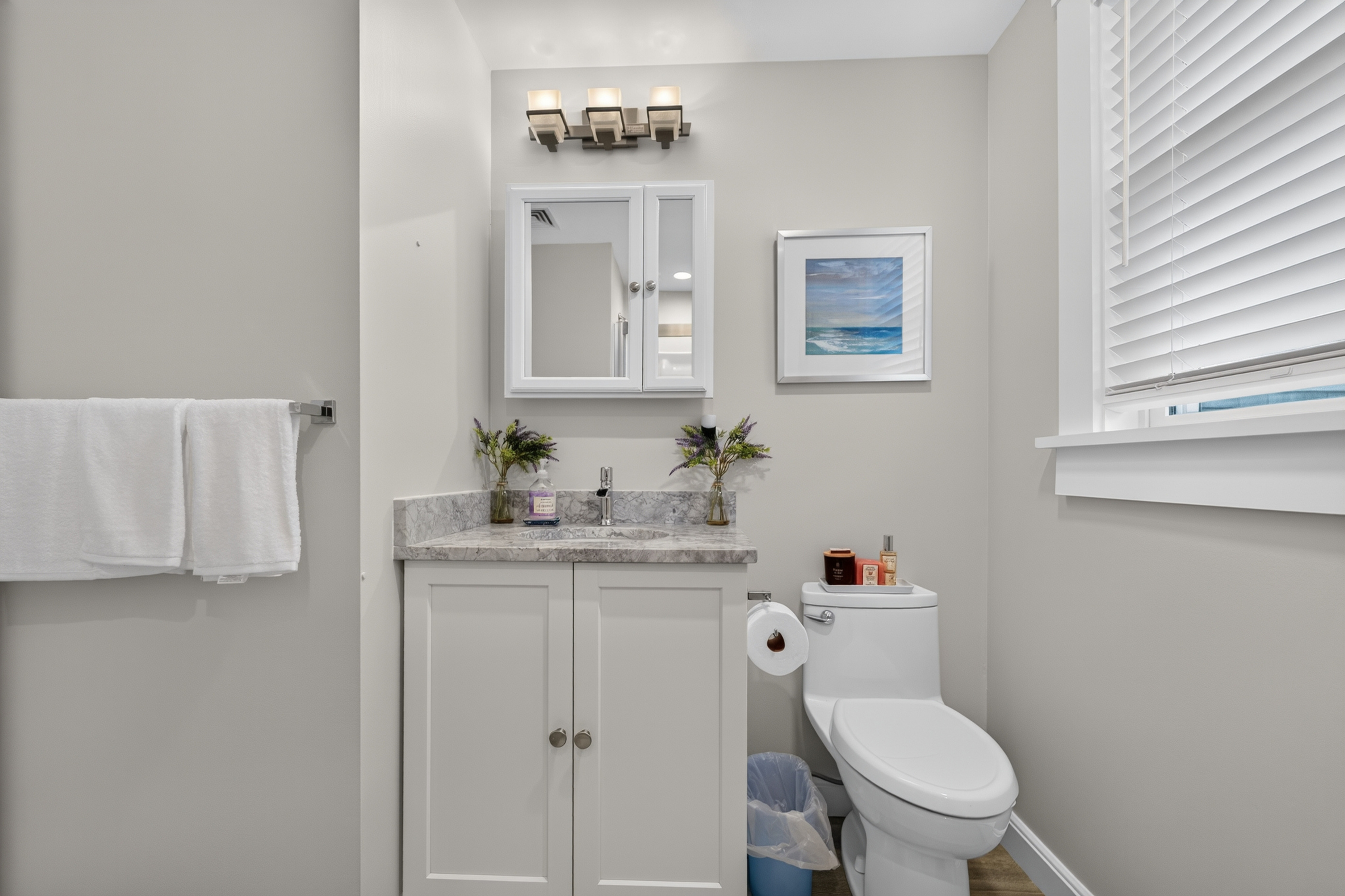 Clean, modern bathroom stocked with essential amenities for a comfortable and convenient stay.