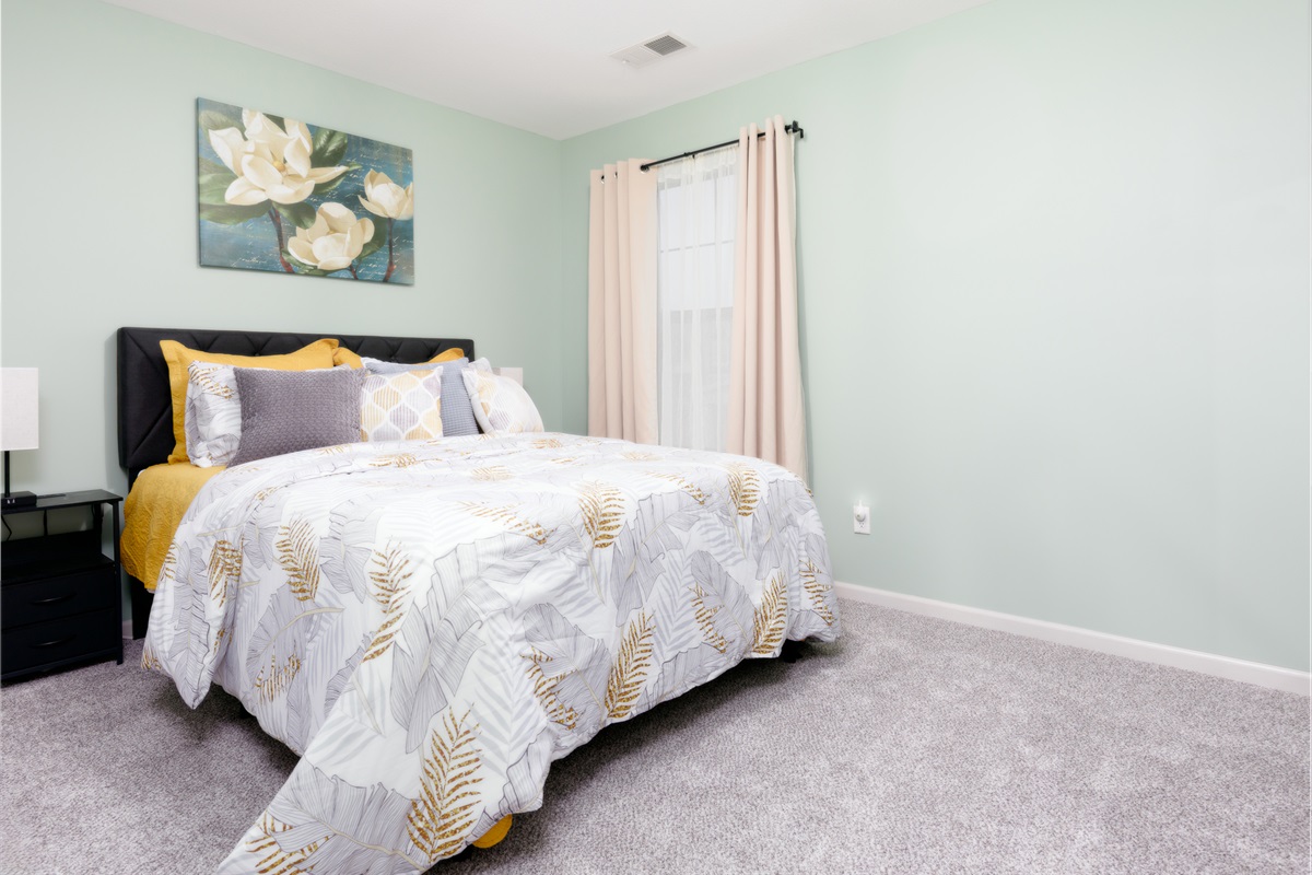Second bedroom with a queen bed, providing a comfortable and restful retreat for guests.