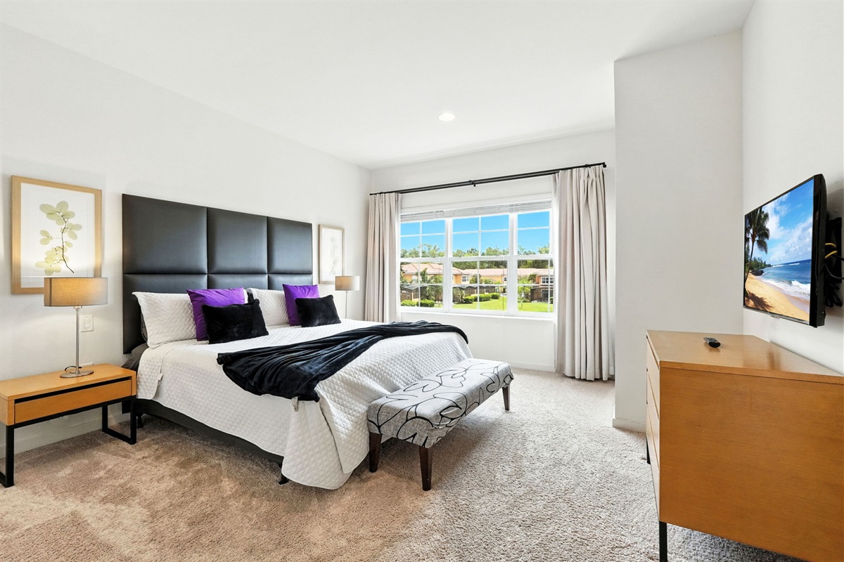 Spacious master bedroom overlooking waterfront