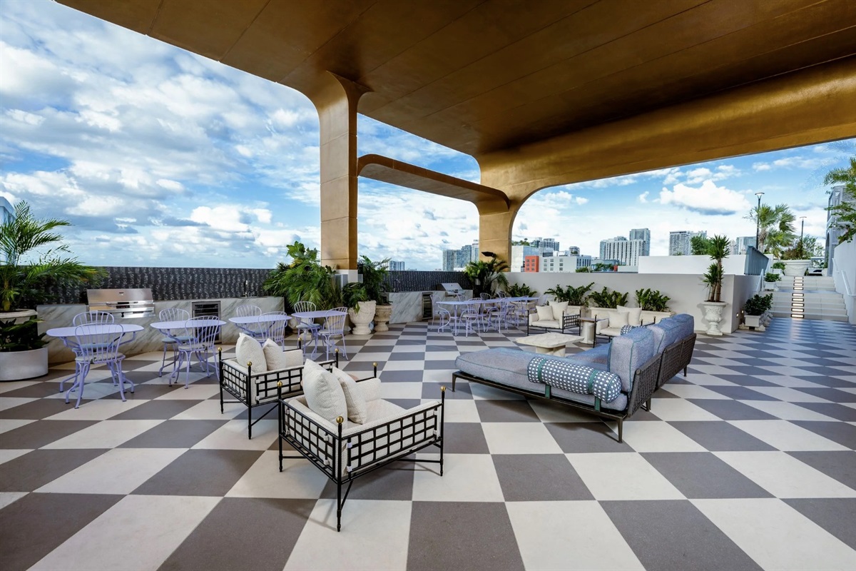 Covered rooftop patio &mdash; outdoor lounge seating under sculptural canopy