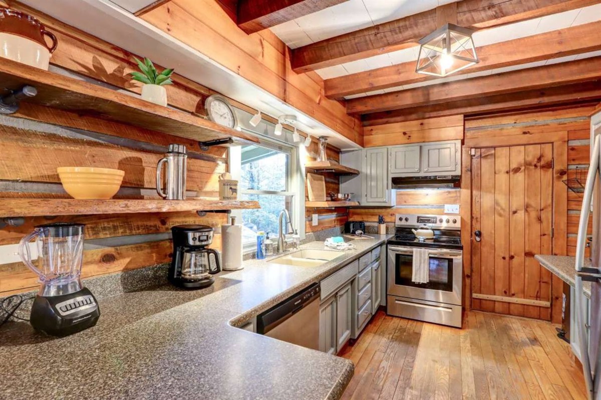 Kitchen in the big cabin.  Well stocked so you can cook meals if you choose to stay in and eat.