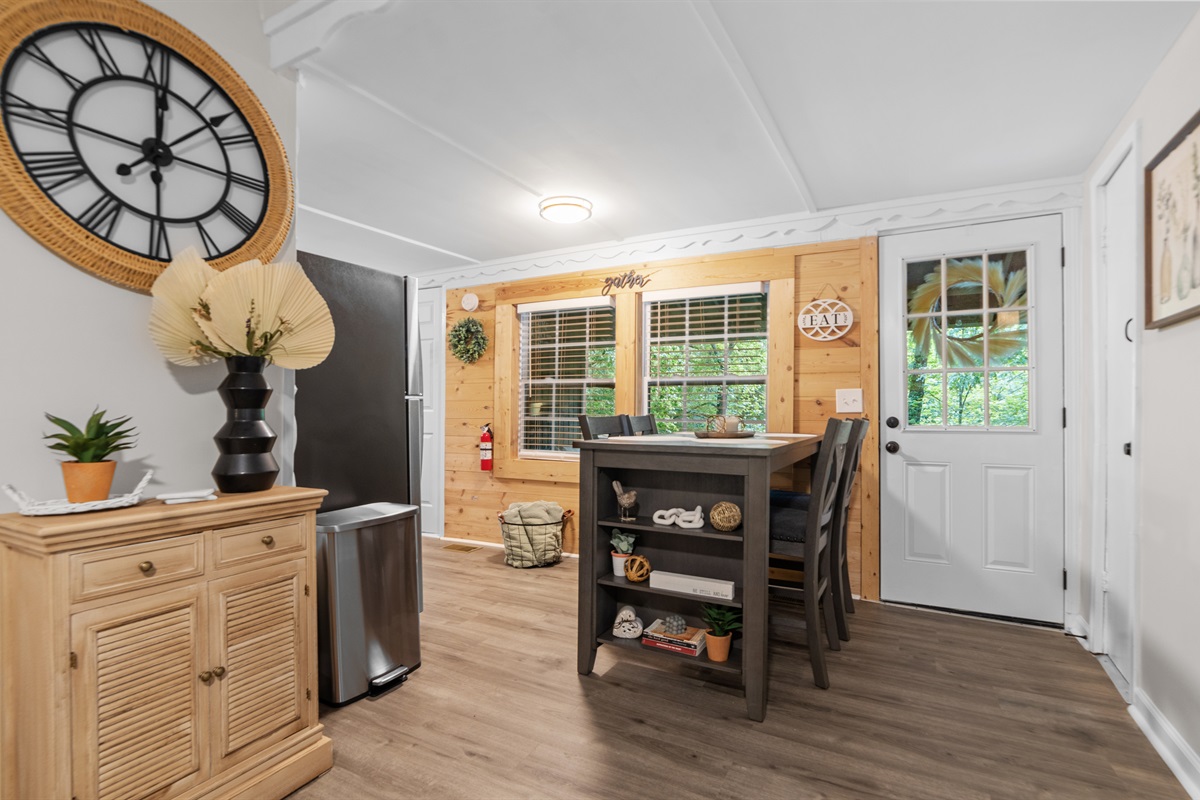 Dining area w/ 4 chairs and views of the babbling creek