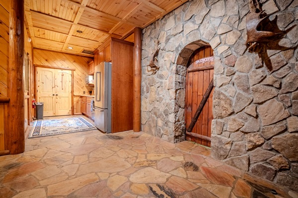 Bottom floor hallway with kids' cave and kitchen