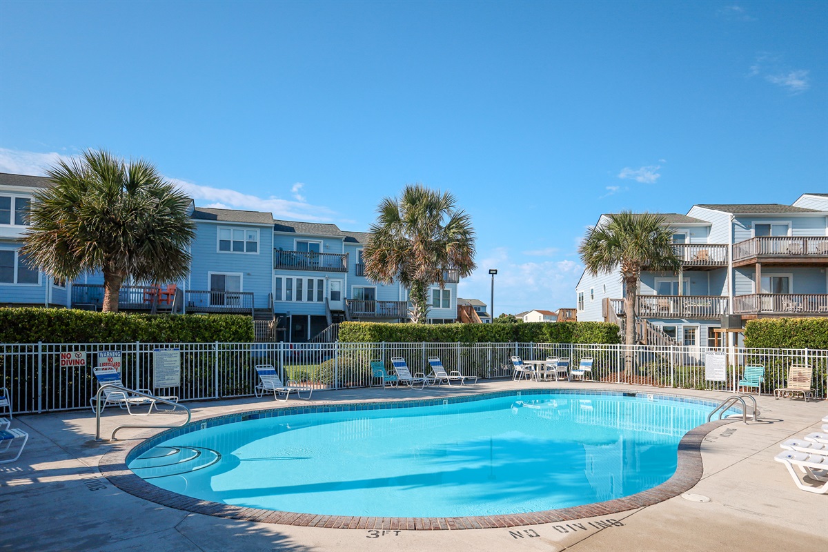Pool area offers views of the water and nearby buildings