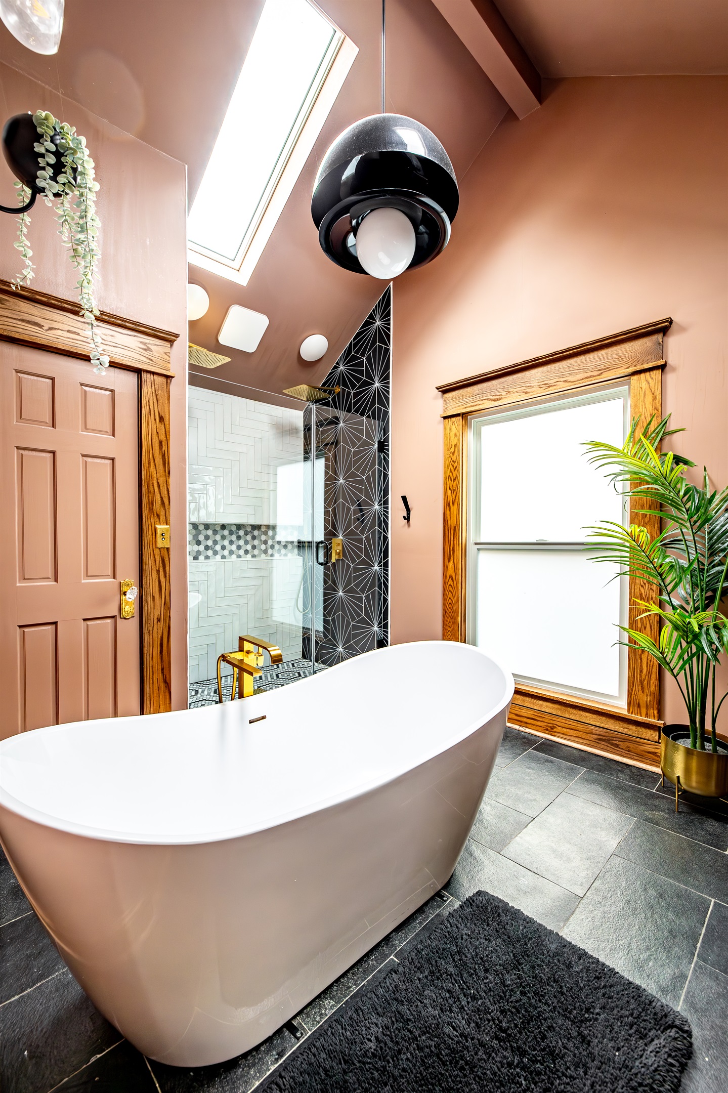 Soak in the tub or wash away the day in the massive shower. Chandelier and skylights