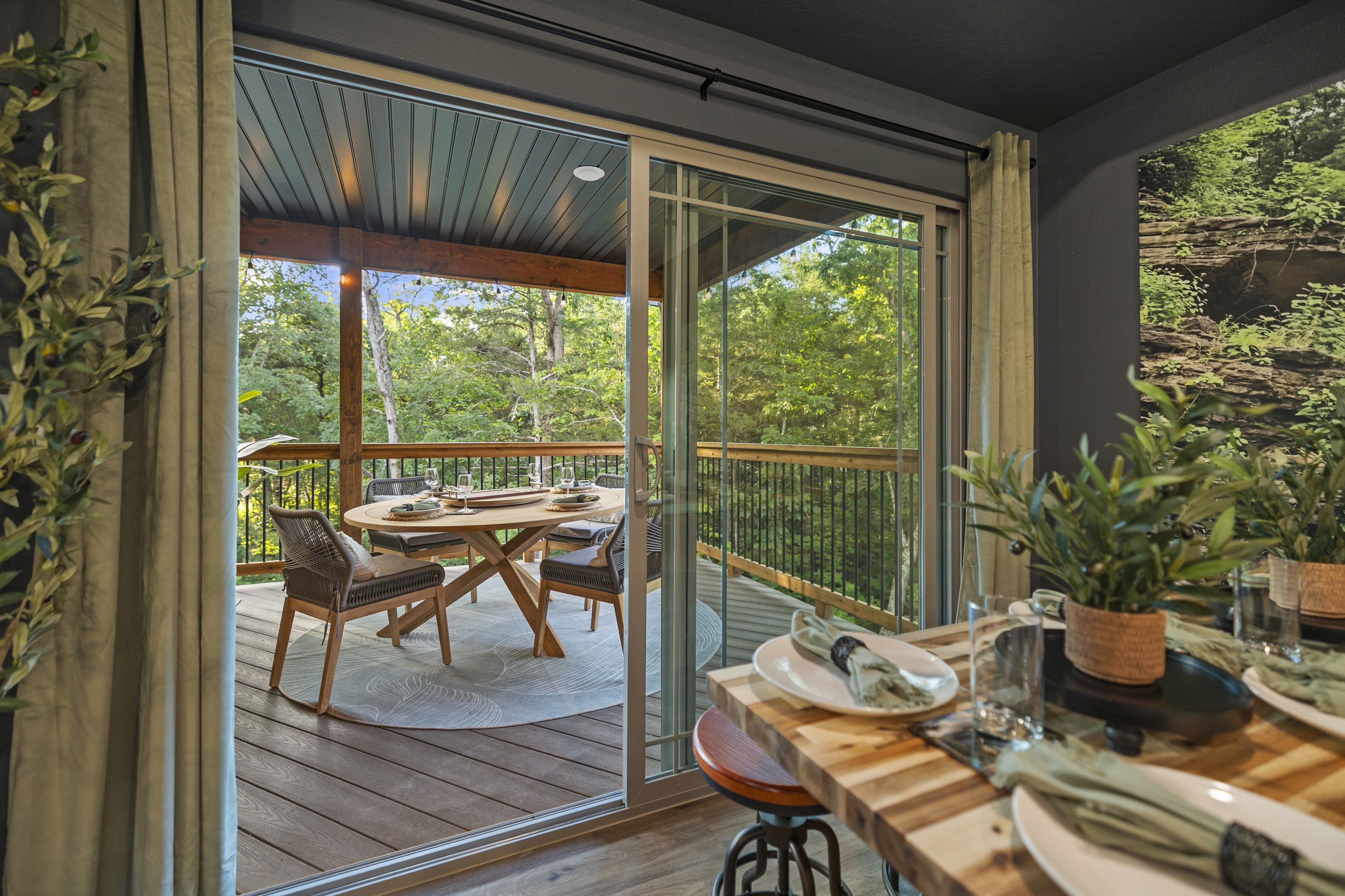 A round bistro table by the screened windows for a quiet morning coffee.