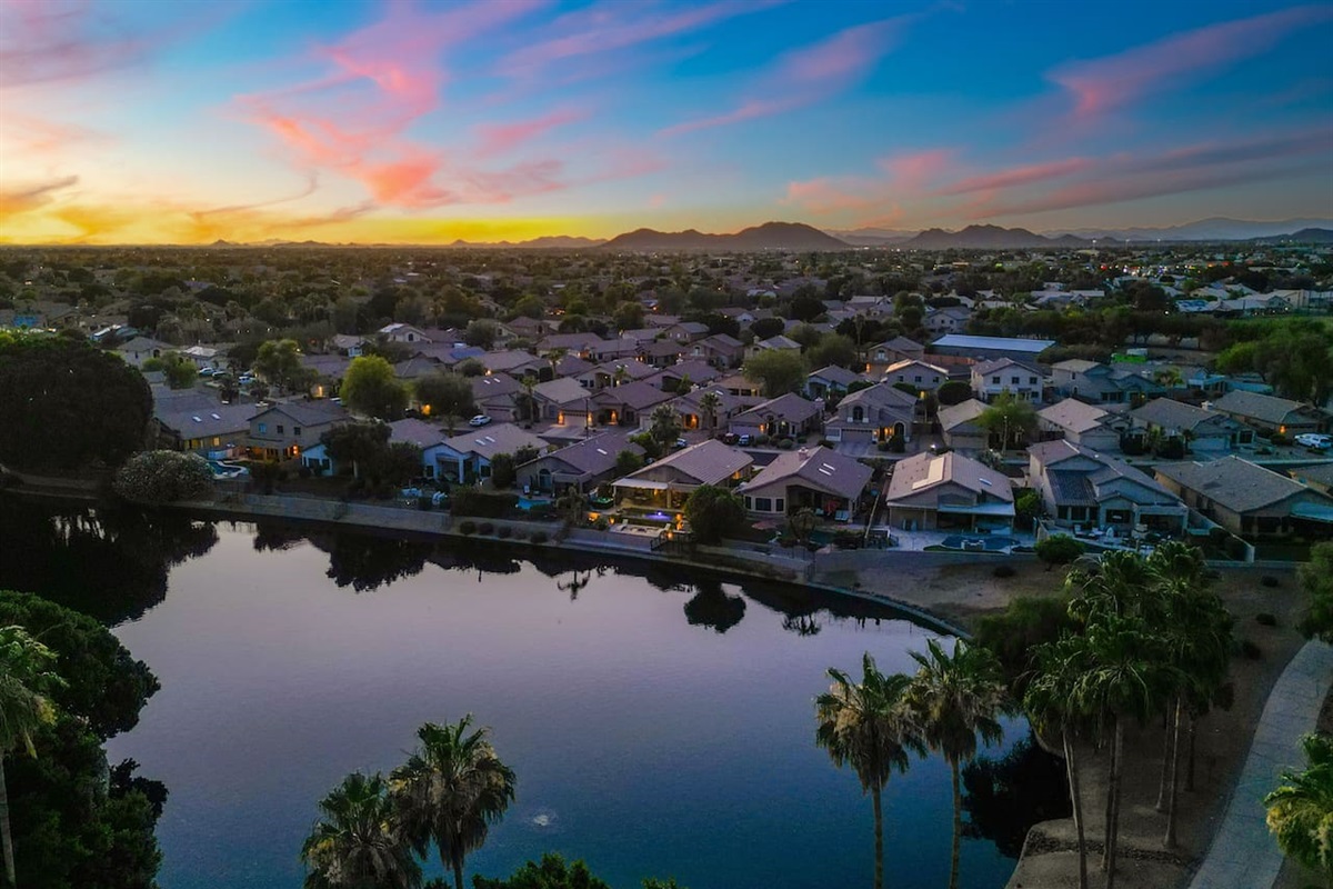 Your backyard sits along a quiet, palm-lined lake that reflects the sunset perfectly — a peaceful backdrop you can enjoy from the patio or the water's edge.