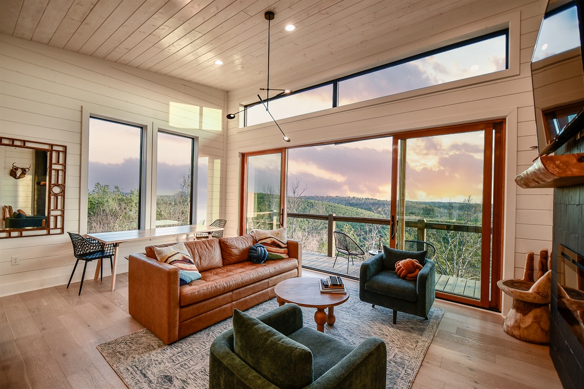 Walls of windows give the perfect mountain backdrop for both dining and lounging with your favorite people! Indoor dining at the table or large bartop and outdoor dining on the deck with enough room for everyone.