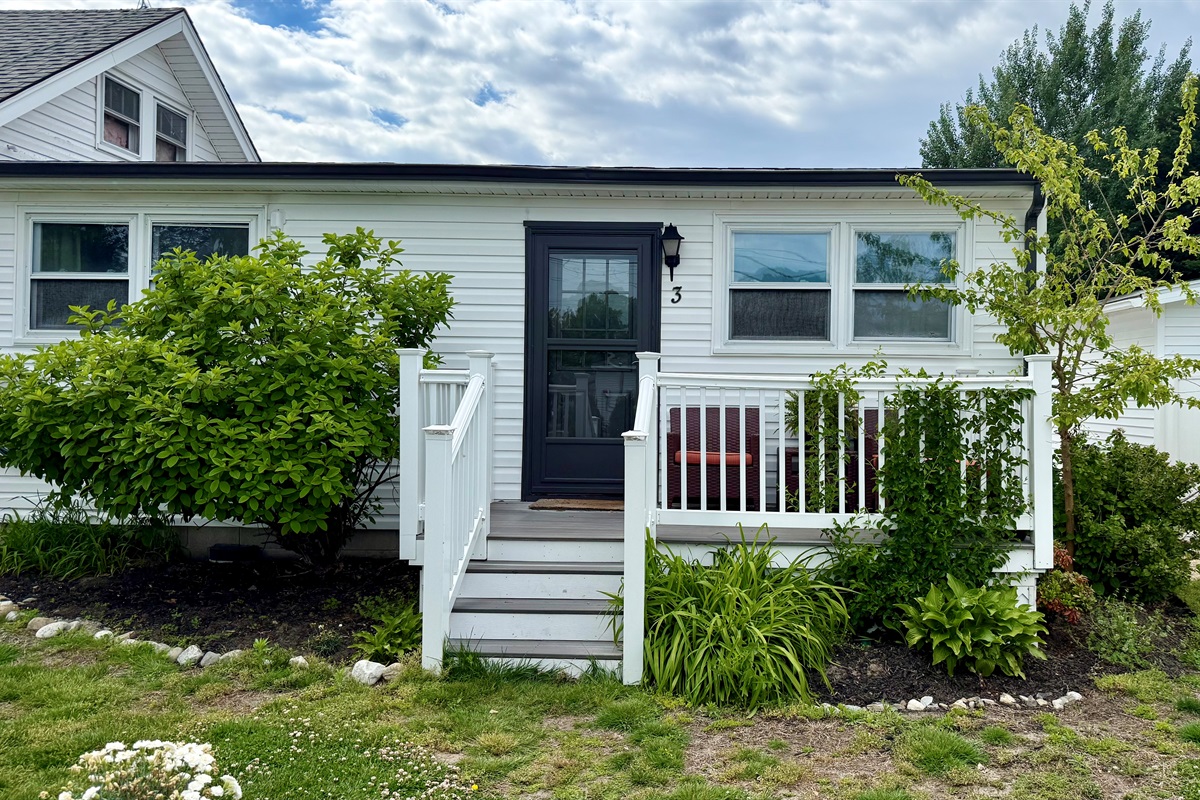 The flat is one of 3 apartments on this property, it occupies a new addition that sits at the back and has its own side and rear yard, along with that sweet front porch.