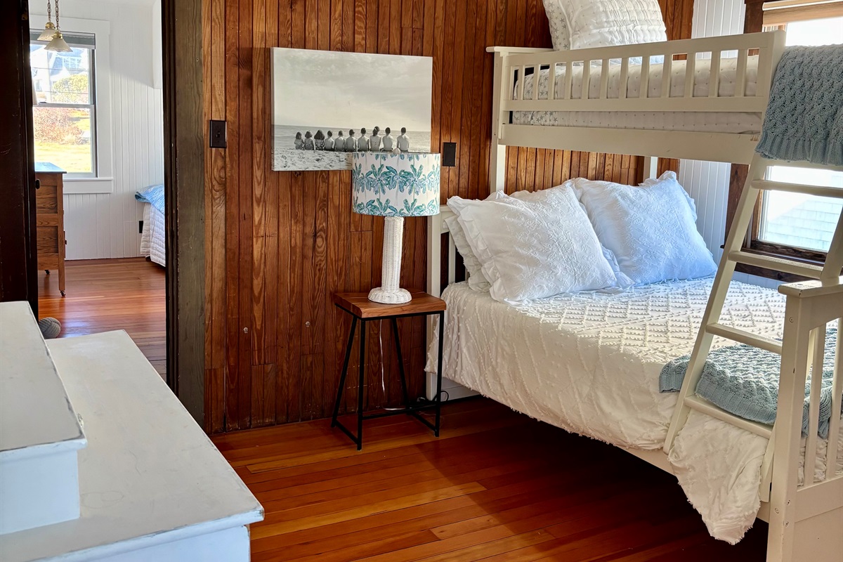 Fun and airy oceanfront bunk room with a twin-over-full setup, ideal for little adventurers or small groups.