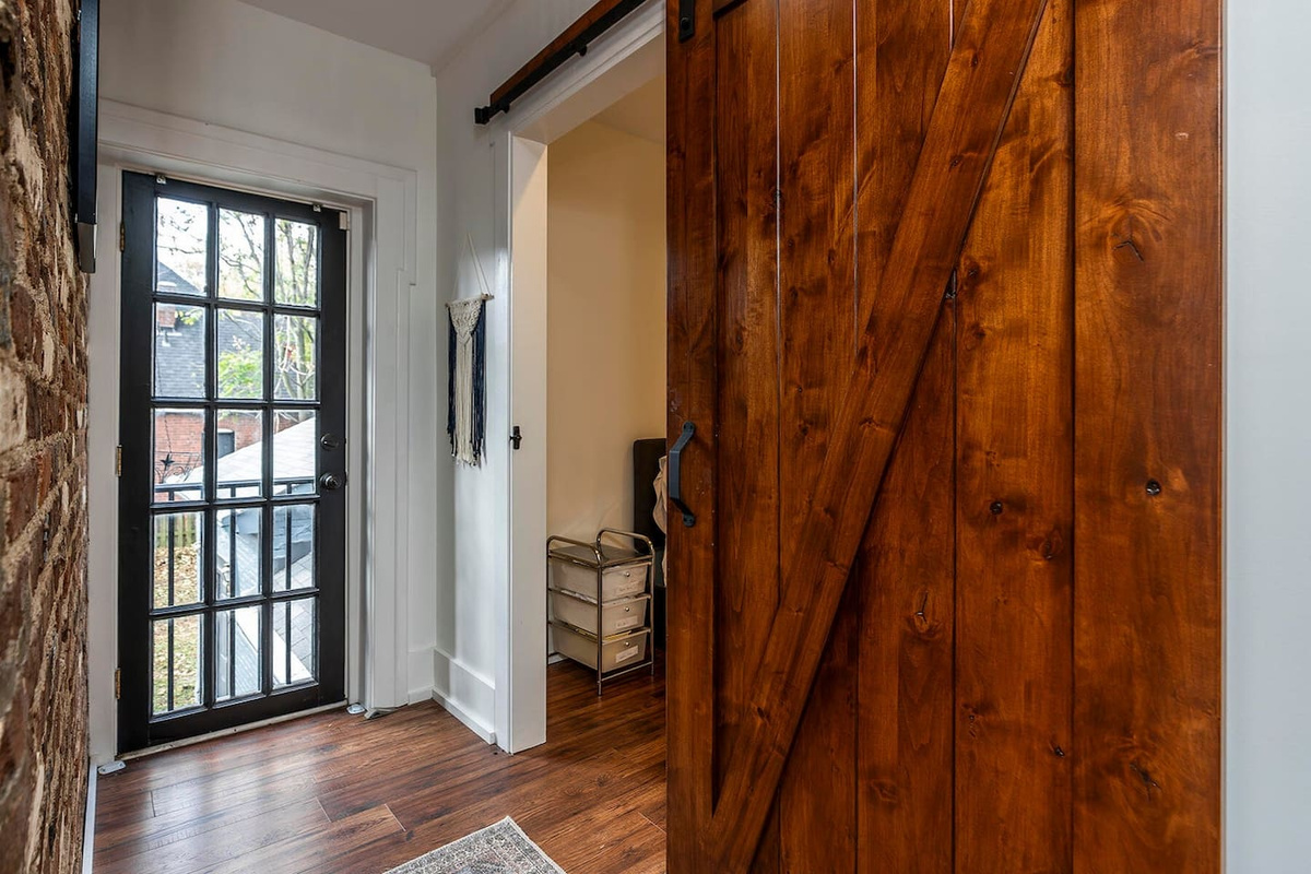 Sliding door to The Photographer Suite. Full bed.