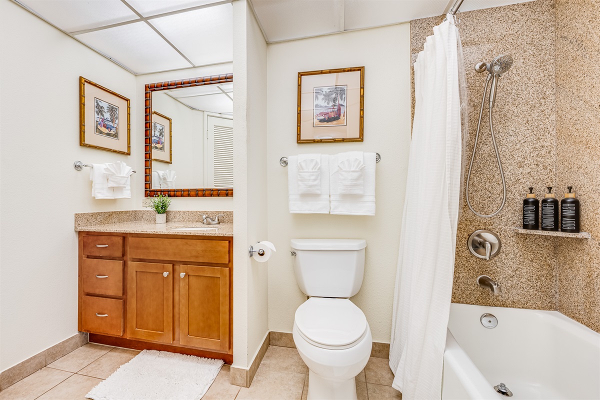 Spacious bathroom with bathtub and shower