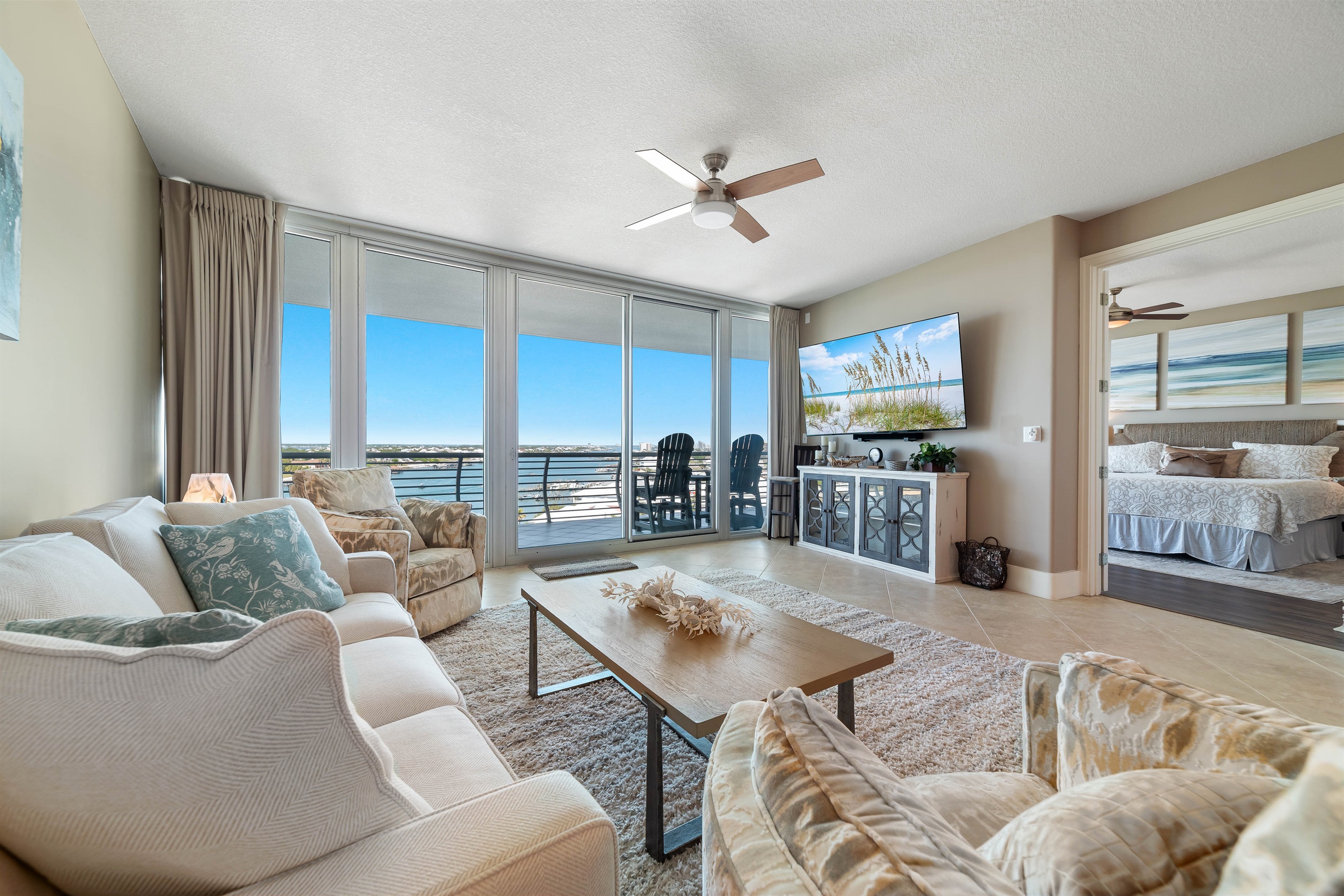 Your waterfront escape awaits. This exquisite condo offers a premium living experience with easy access to the vibrant atmosphere of Flora-Bama.
