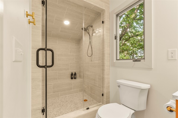 Huge walk-in shower with bench. 