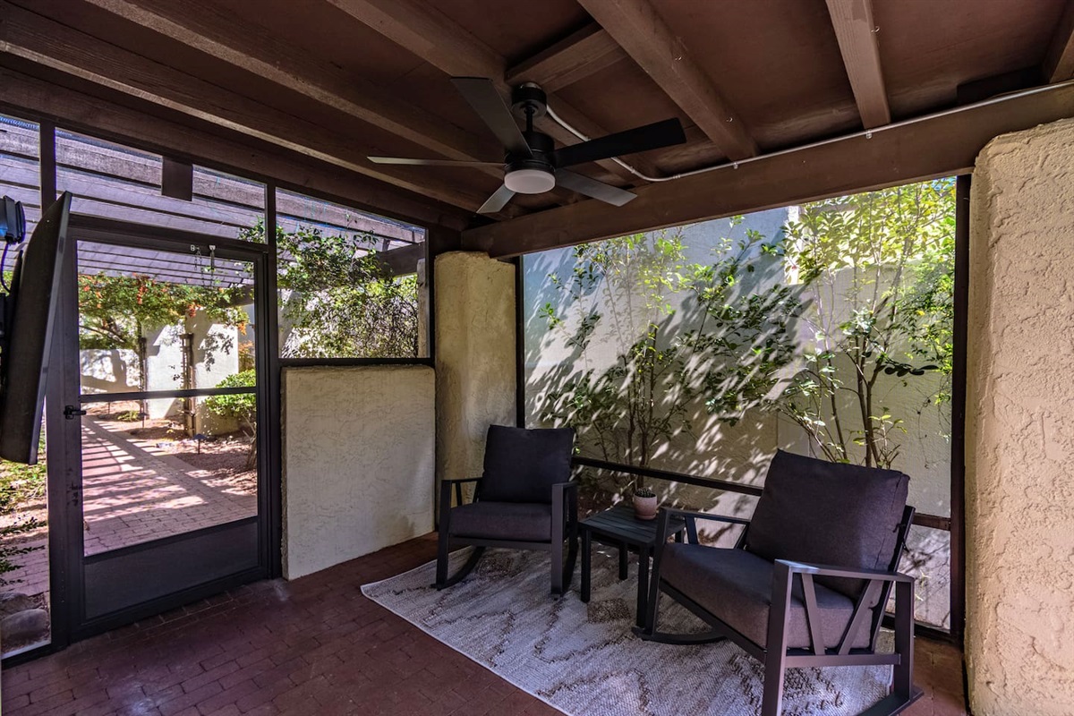 Fully screened-in, outdoor seating area with television!