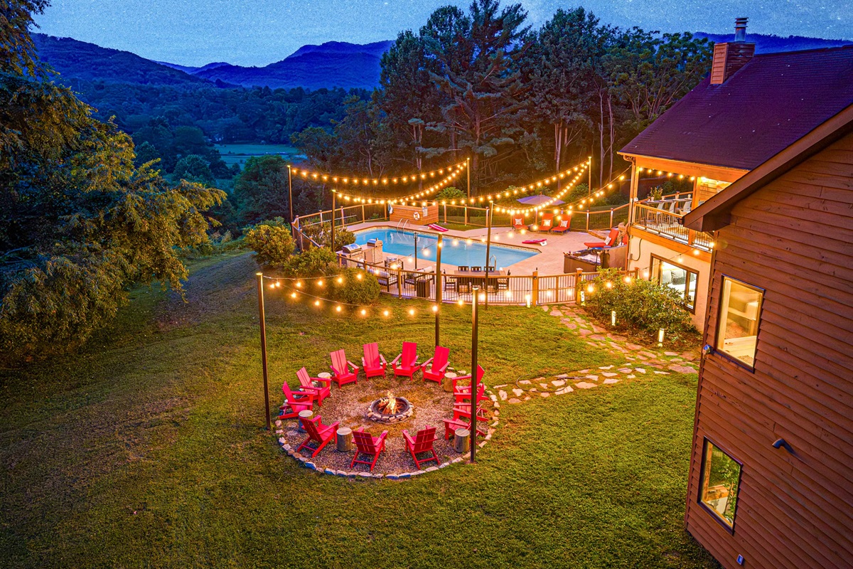 An unforgettable retreat—string lights twinkle over the pool and fire pit as the mountains fade into night, creating the perfect backdrop for laughter, connection, and memories under the stars.🌌✨