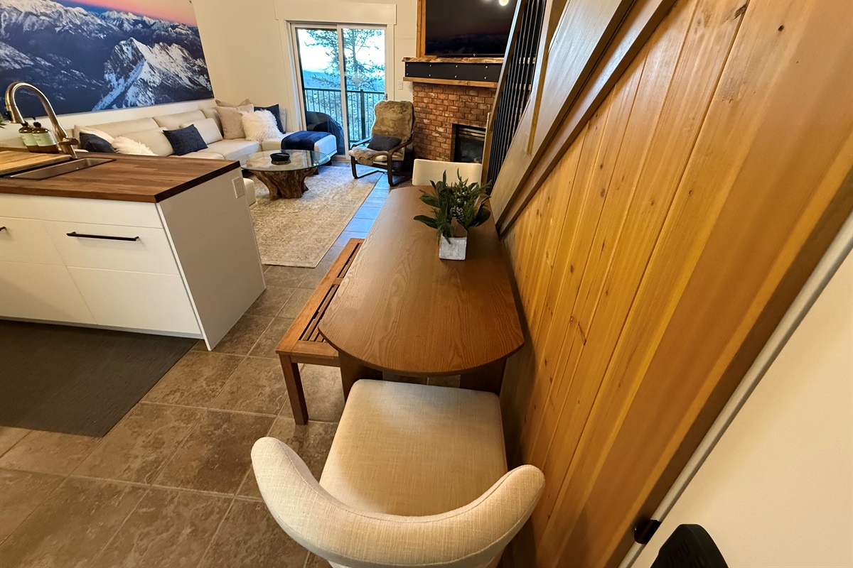 Open-Concept Dining Area: Enjoy meals in the open-concept dining room, which flows seamlessly into the kitchen and living area, providing seating for four with the option to expand.