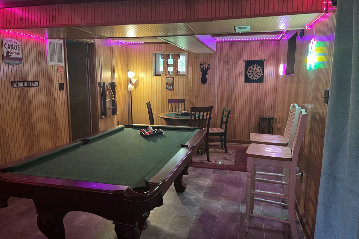 Relax downstairs with a game of pool or gather around the game table for cards, board games, or puzzles—the perfect spot to unwind after a day at the river.