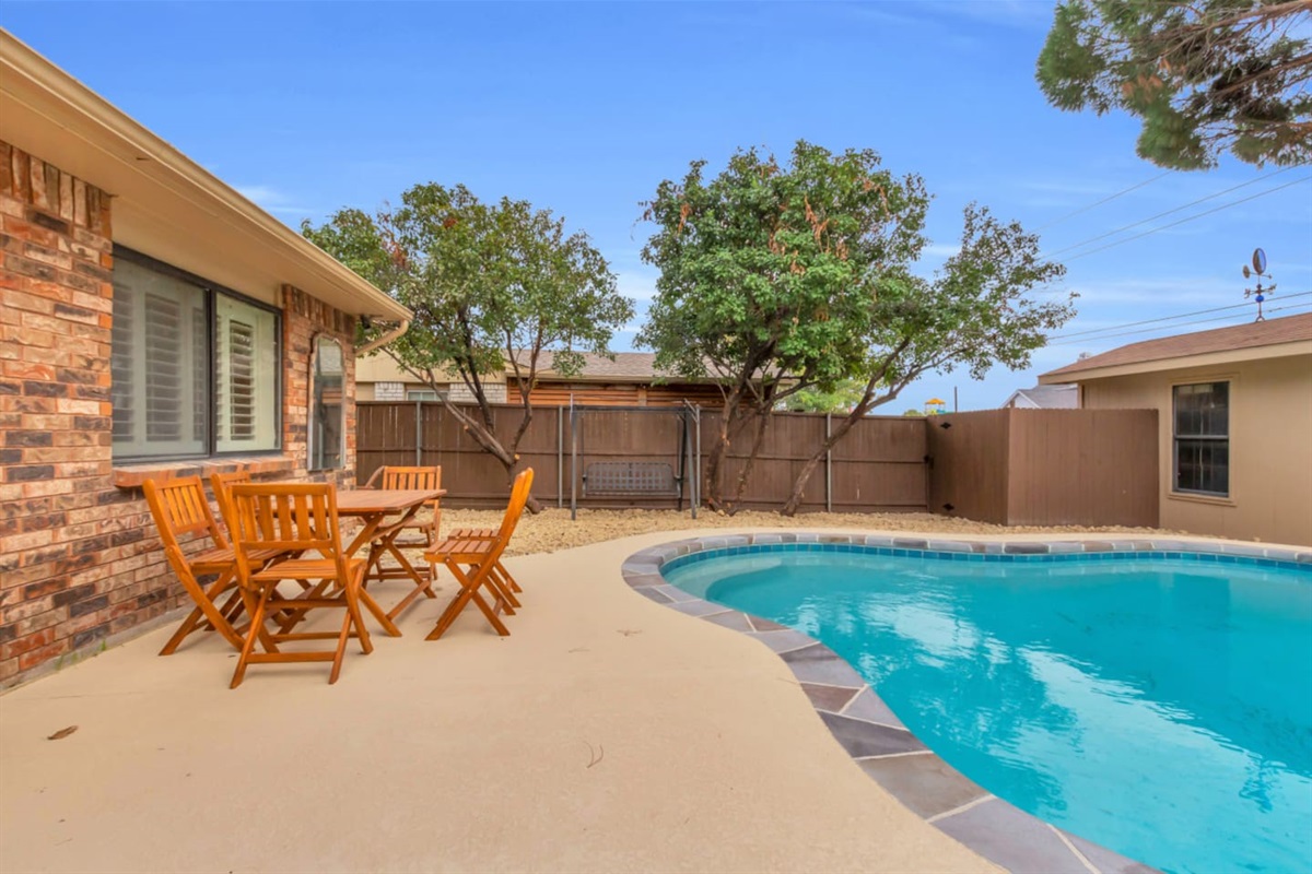 Refreshing private pool surrounded by a fully fenced garden and natural shade—ideal for warm Texas days. Outdoor dining for meals enjoyed together; seating for 6.