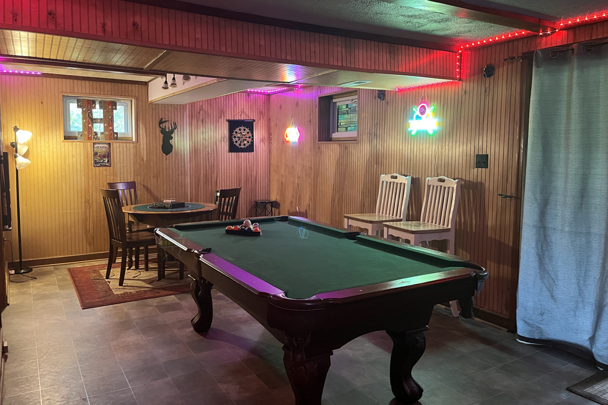 Relax downstairs with a game of pool or gather around the game table for cards, board games, or puzzles—the perfect spot to unwind after a day at the river.