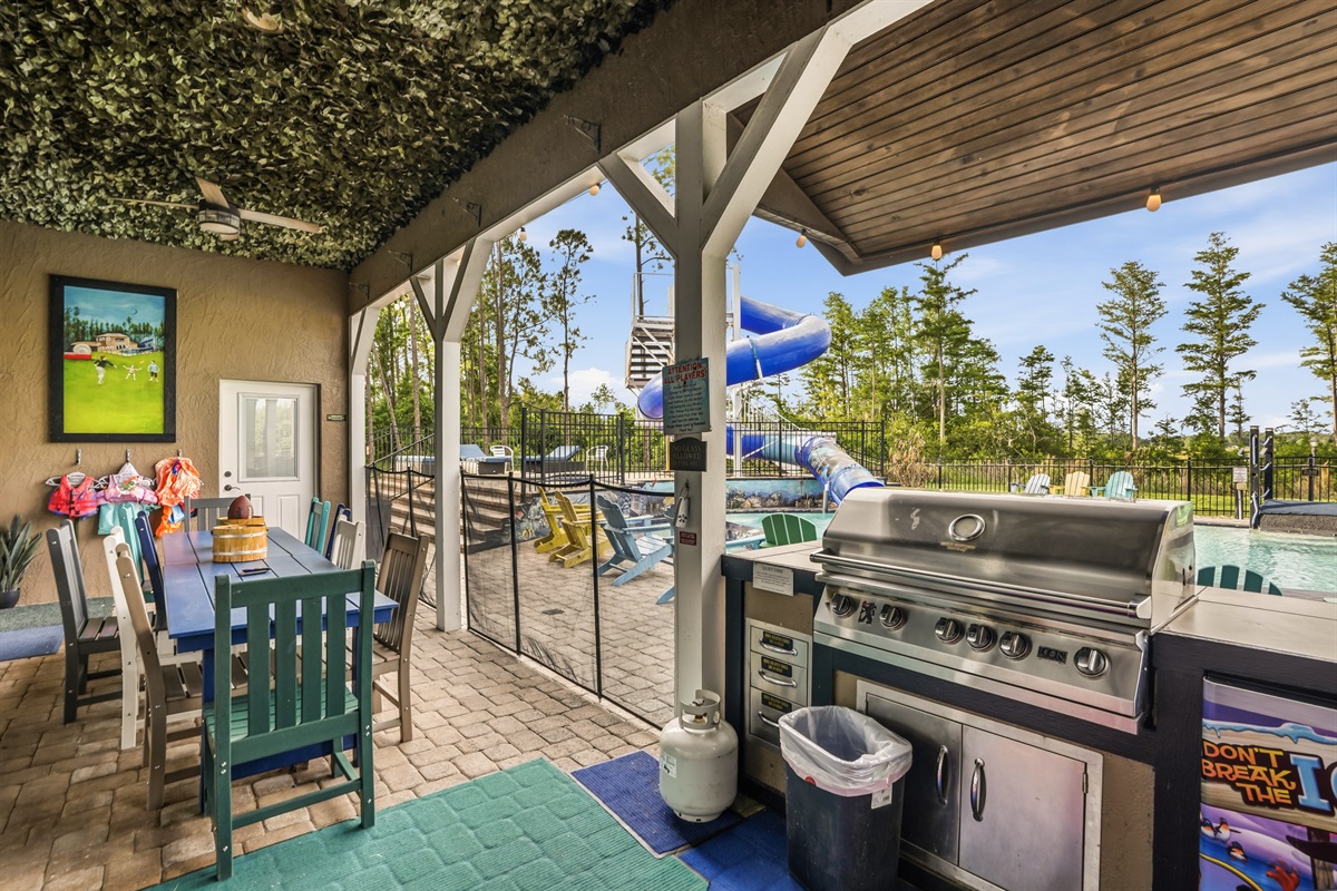 Outdoor kitchen and grilling area at Orlando lakefront estate