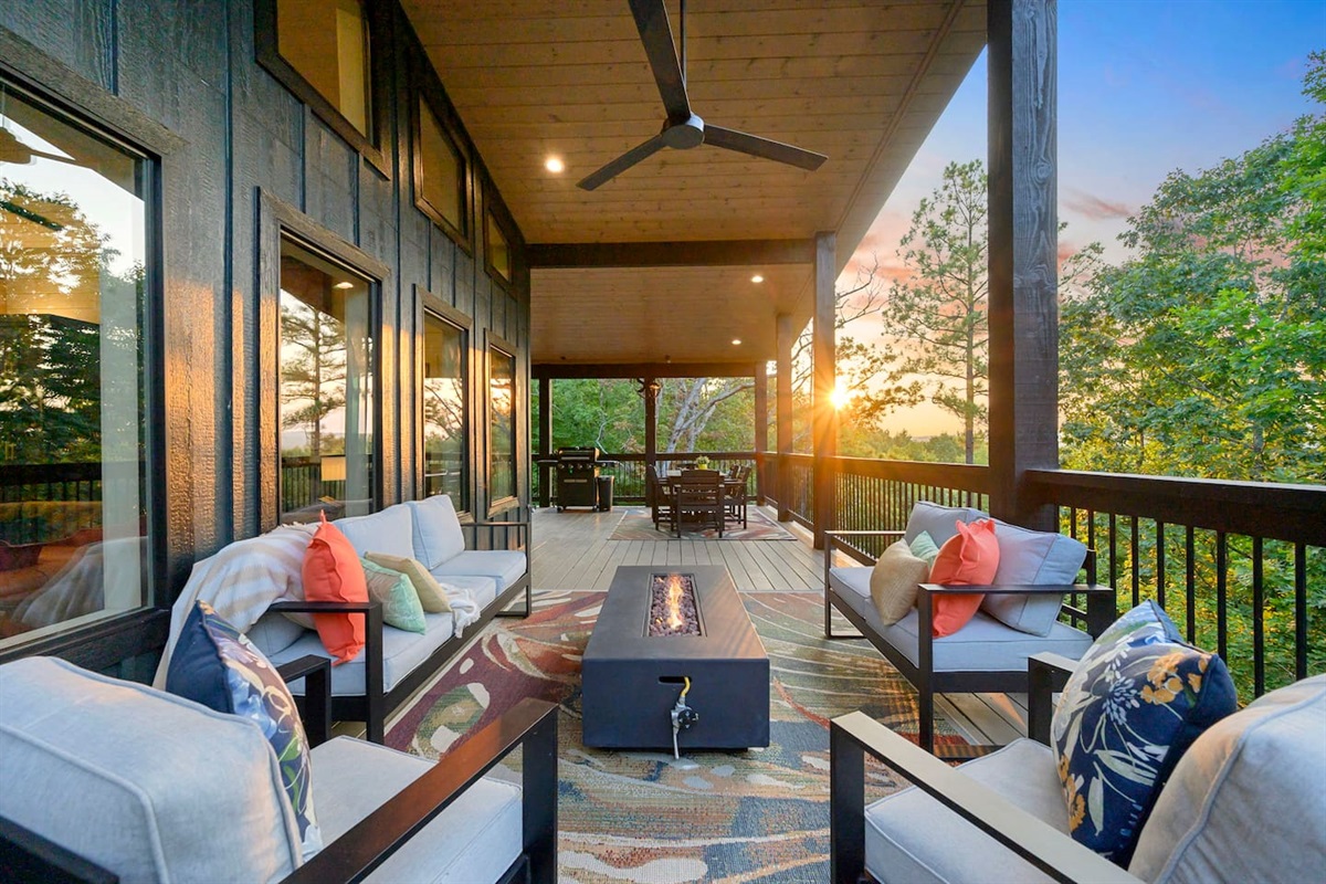 Upper balcony has plush outdoor seating, a fire pit, grill and outdoor dining table.  Check out that view!