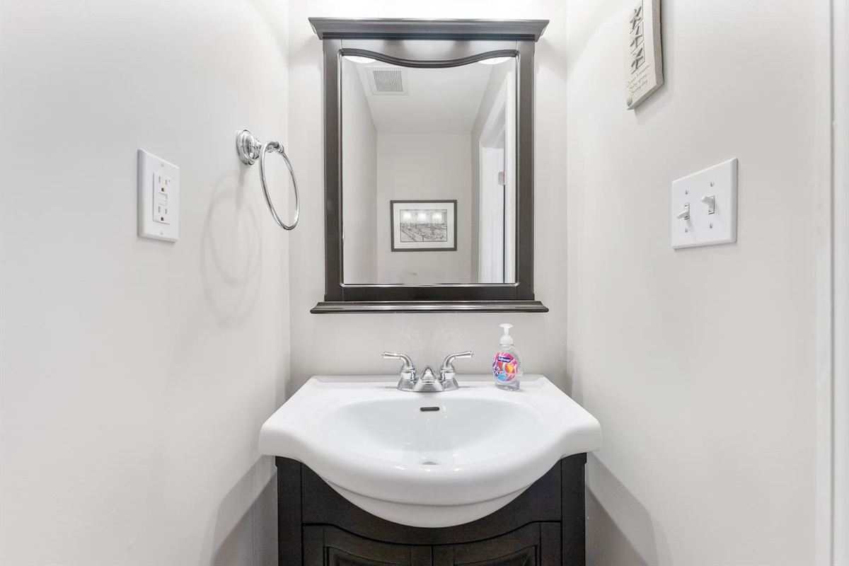 Large half bath with vanity. 
