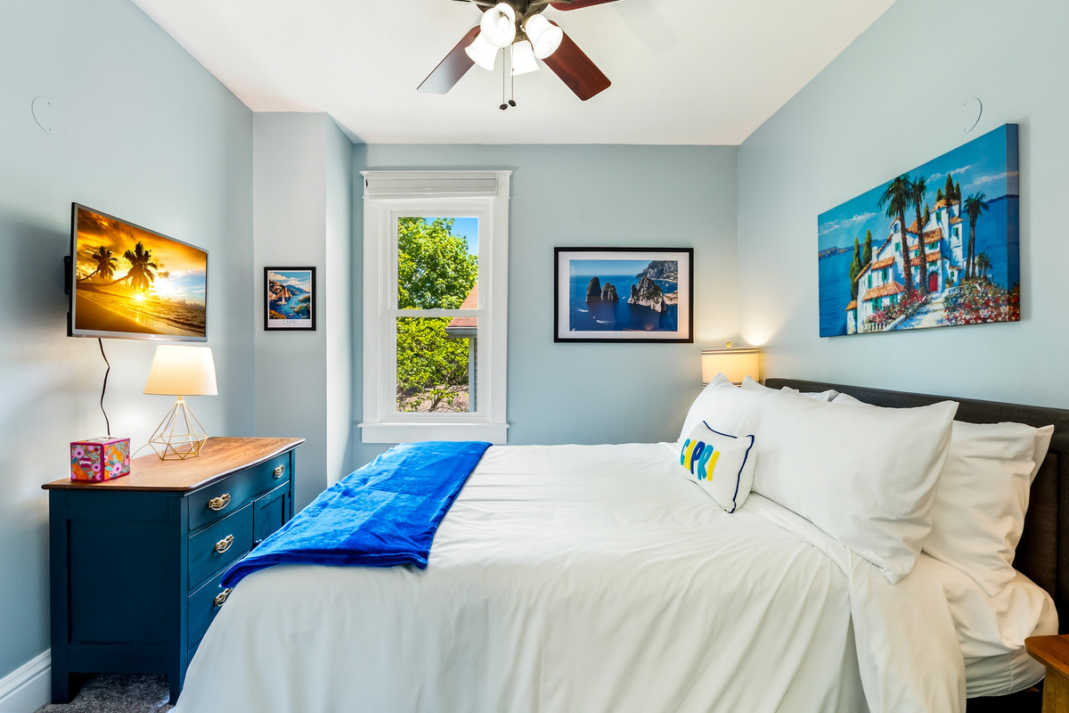 The upper-floor Capri Room provides a cozy, quiet retreat away from the main living spaces. Features a comfortable queen bed, Roku Smart TV, noise machine and soft, relaxing lighting.