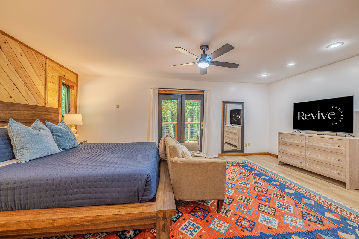 Unwind in bed with your favorite show on the Smart TV, then step directly onto the deck to breathe in the fresh mountain air.