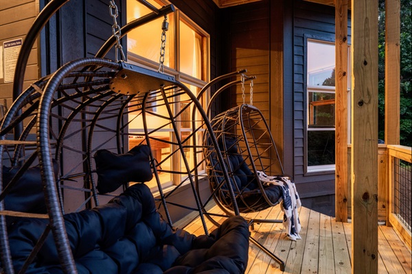 Oversized egg chairs — the perfect spot for morning coffee or evening wine with a view