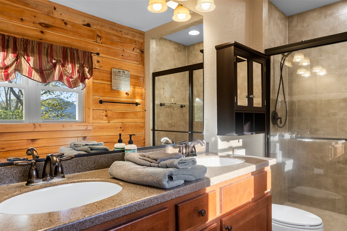 Bathroom: Elegant dual sinks in a sunlit space, with mountain views to enhance your pampering!