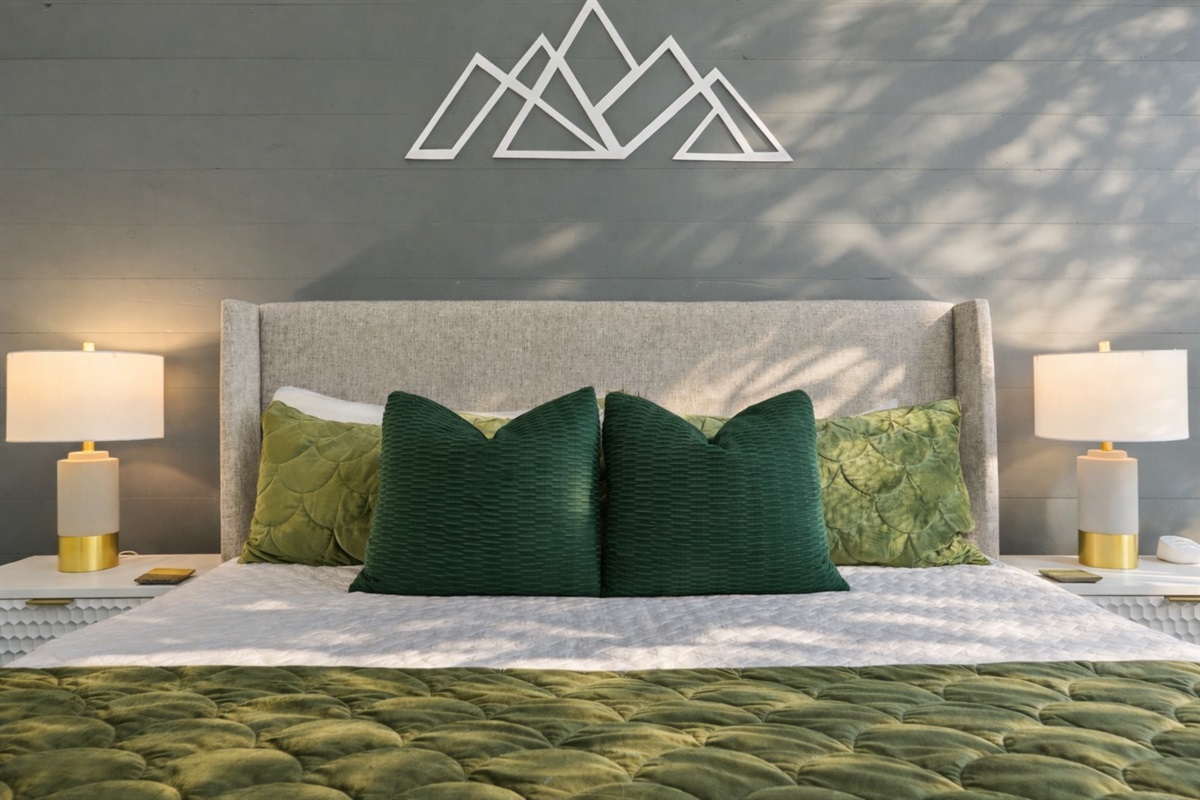Drift into comfort in this serene primary bedroom where soft textures, calming tones, and thoughtful details create the perfect place to rest and recharge after a day in the mountains.
