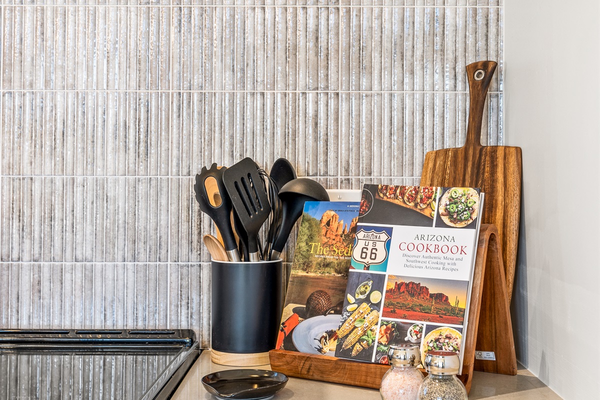 Small, thoughtful touches throughout the kitchen—local cookbooks, quality tools, and intentional details - make cooking in feel easy and enjoyable.