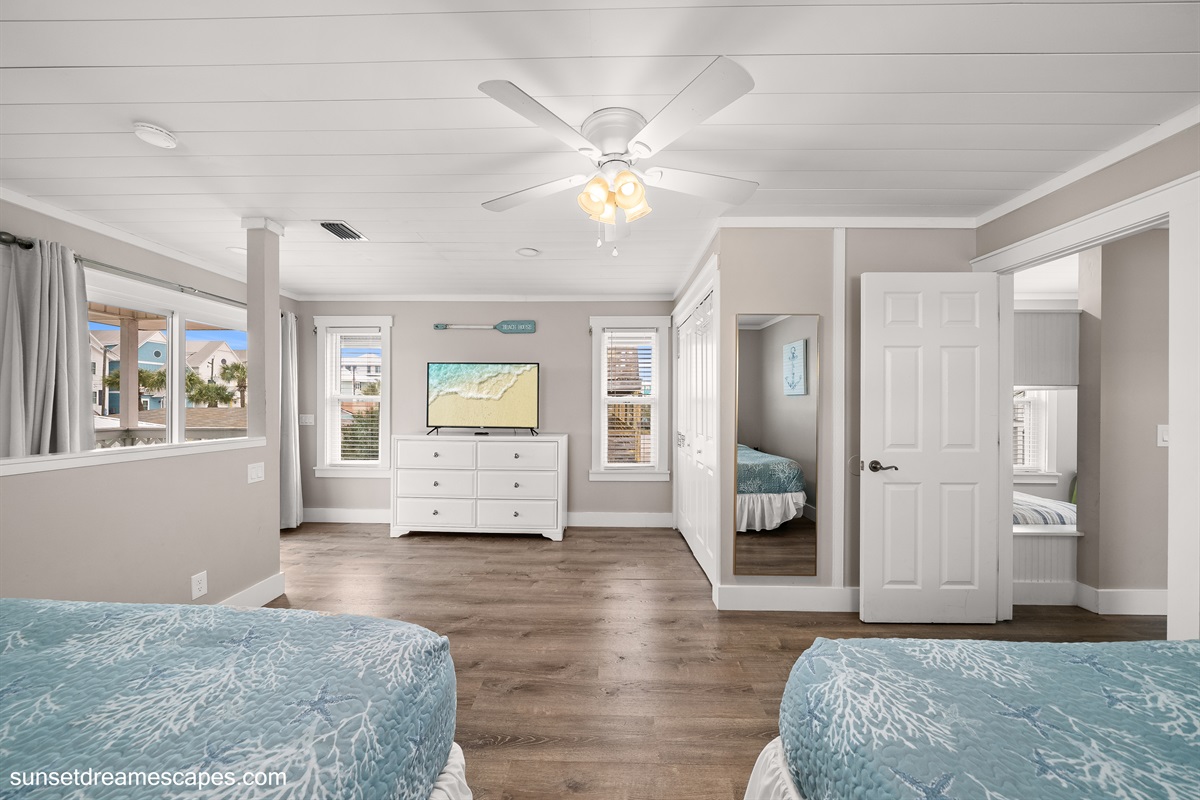 The loft bedroom provides access to the upstairs balcony. Sip coffee while listening to the waves and watching the tide come in.