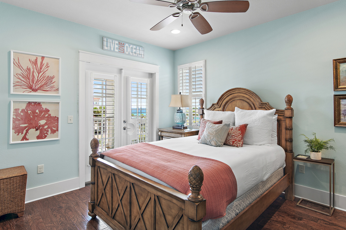 Relax in this beautifully appointed coastal bedroom, featuring a comfortable king bed and soothing beach inspired décor.
