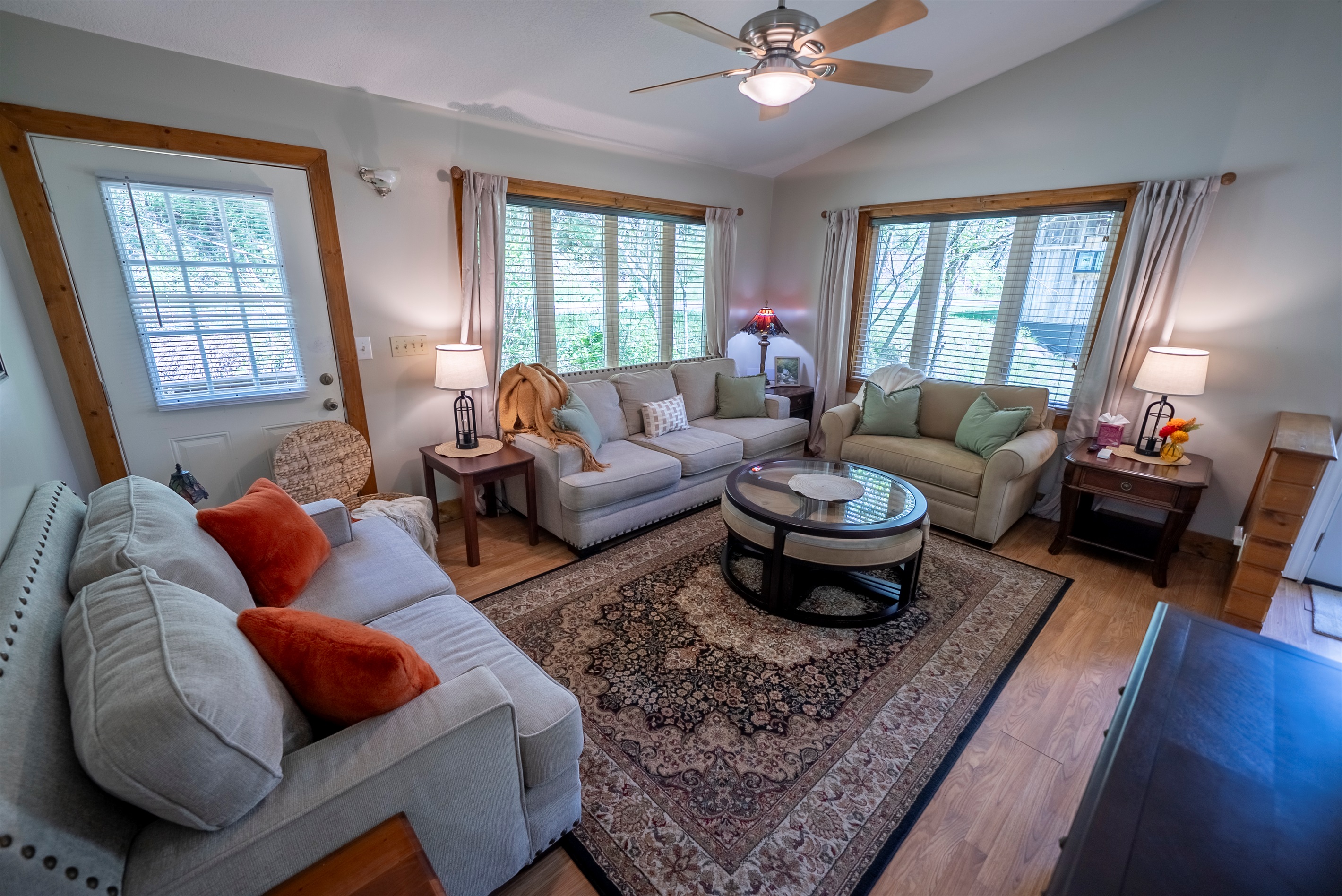 Spacious living area with flexible seating, including a convertible chair that turns into a twin bed, perfect for extra guests.