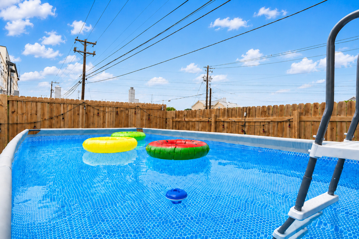 Dive into fun with a sparkling pool and vibrant floaties under the Texas sun!