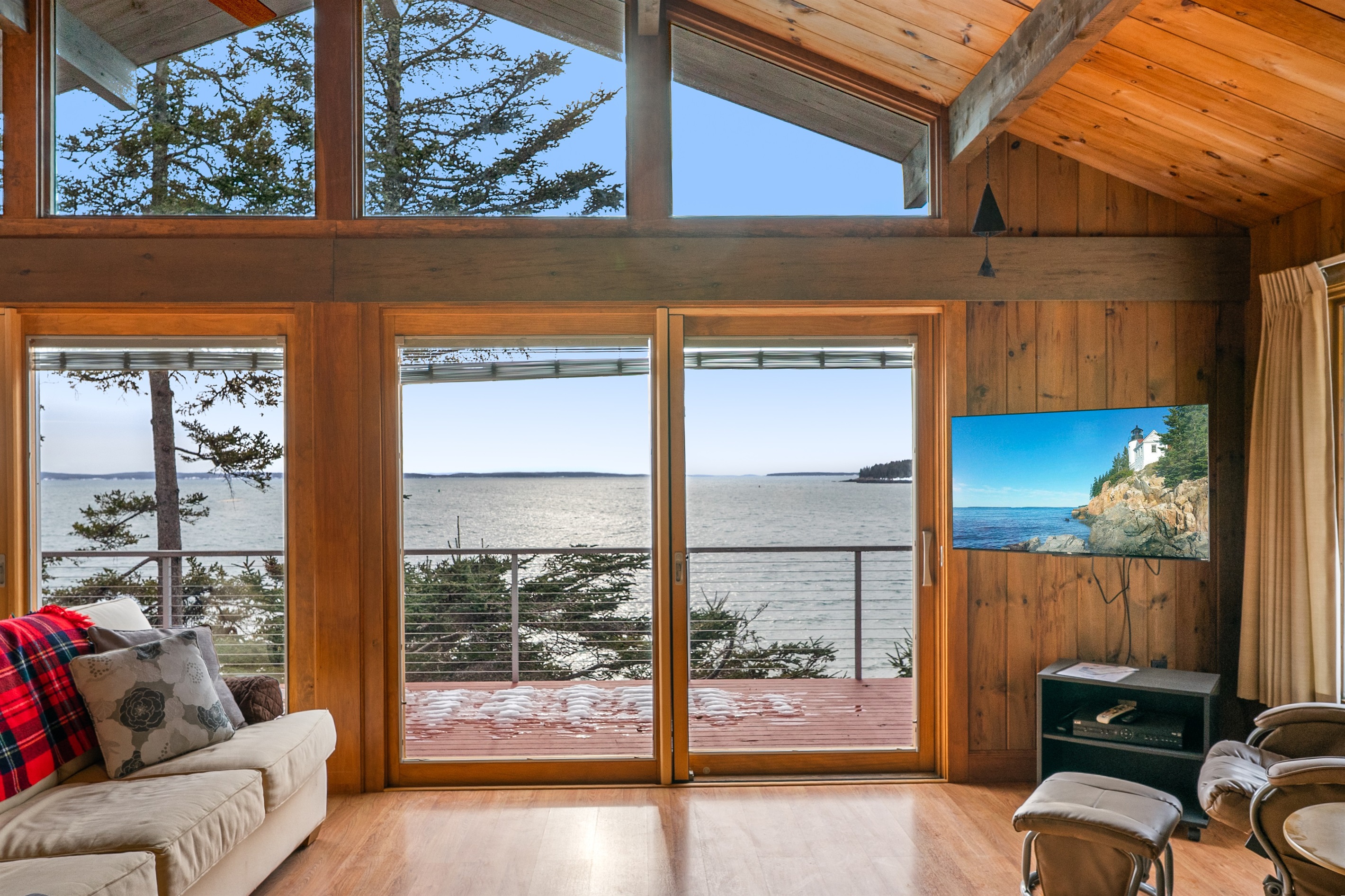 Walls of glass frame the ever-changing tides and western sunsets over Bass Harbor.