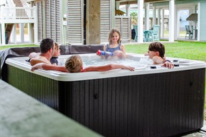 Making family memories one bubble at a time! Dive into relaxation with our hot tub amenity. 🛁 #FamilyTime #HotTubFun