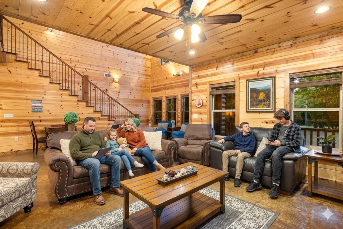 Step into a grand open-concept living space, where the elegant staircase beckons you to explore the luxurious bedrooms upstairs.