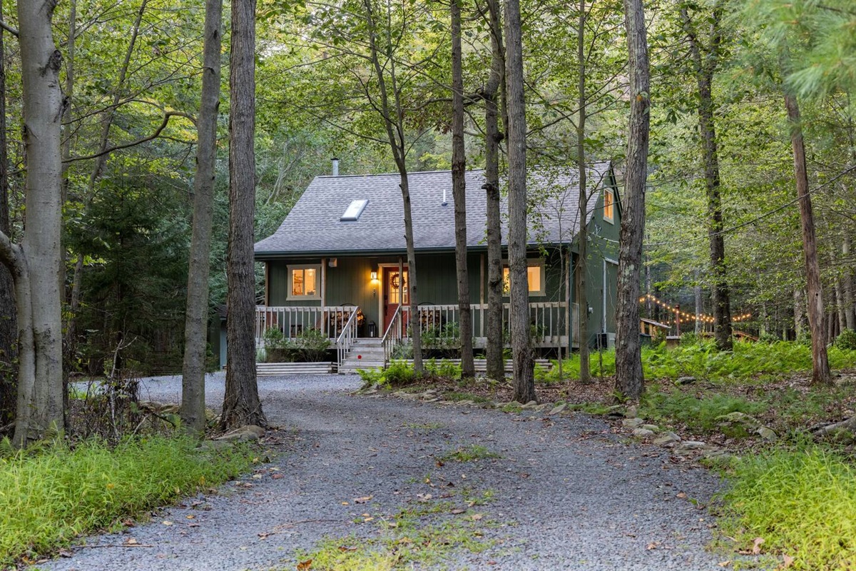 The Pine Cabin is Tucked Back into the Woods