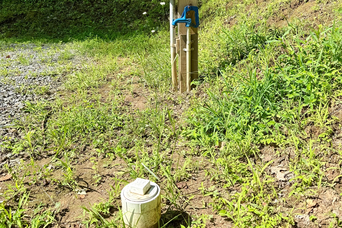 Pull in, plug in, and relax! Site 3 has 50-amp service, water & sewer, plus a picnic table for outdoor meals.