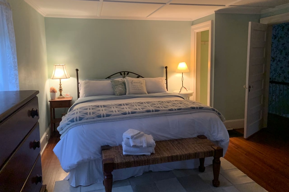 Primary bedroom with king size bed and private bathroom 
