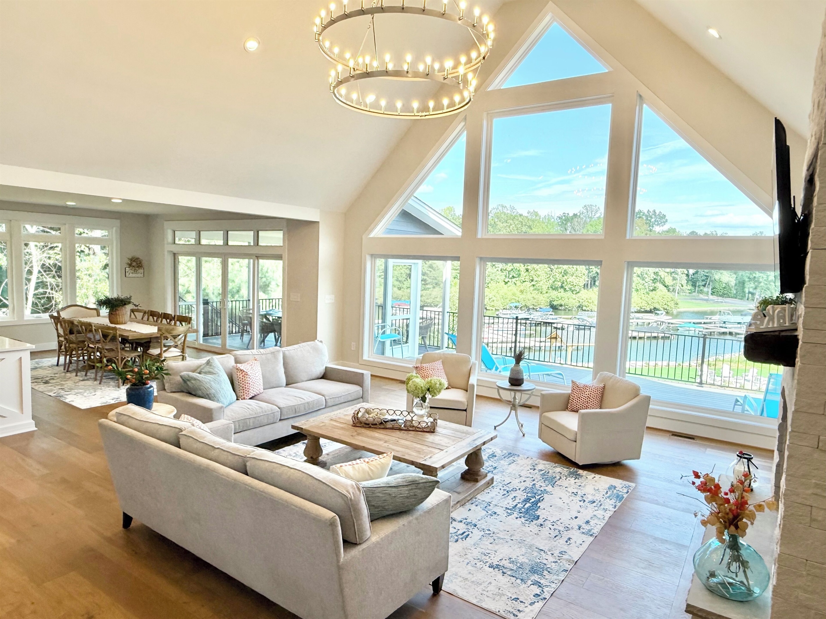 The heart of Blueberry Bay is our great room where an entire two level wall of windows shines panoramic views of the lake and floods this South facing house with natural light all day! The sunrises are stunning also and not to be missed-our favorite!