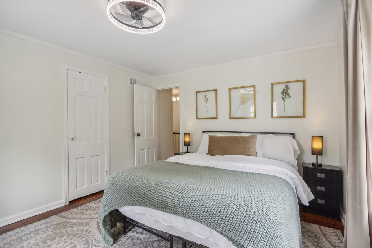 Recharge on the plush pillow-top Queen bed, with warm bedside lighting, closet storage, and a multi-drawer vanity to keep everything organized.
