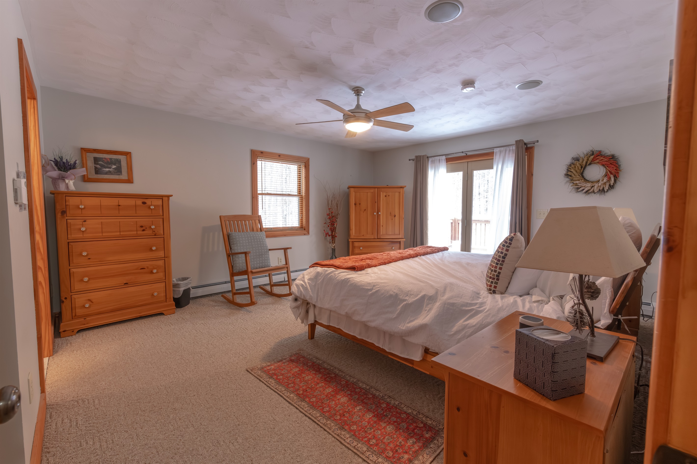 Master Bedroom with an ensuite bathroom and walk out balcony to enjoy the mountain air for your morning cup of coffee.