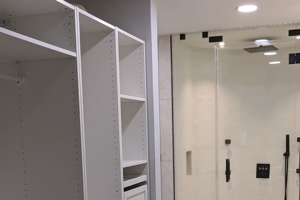 Here is a view of the other side of the closet system with a peak of the primary bath shower. 